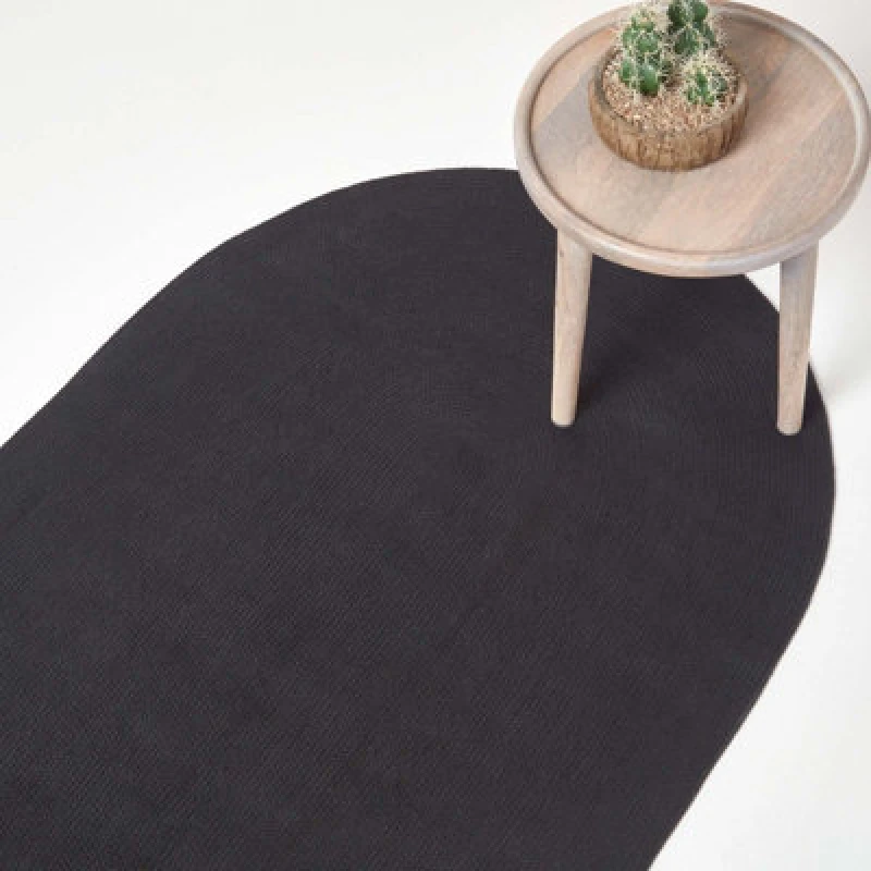 Image of Homescapes Black Handmade Woven Braided Oval Rug, 60 X 90 Cm