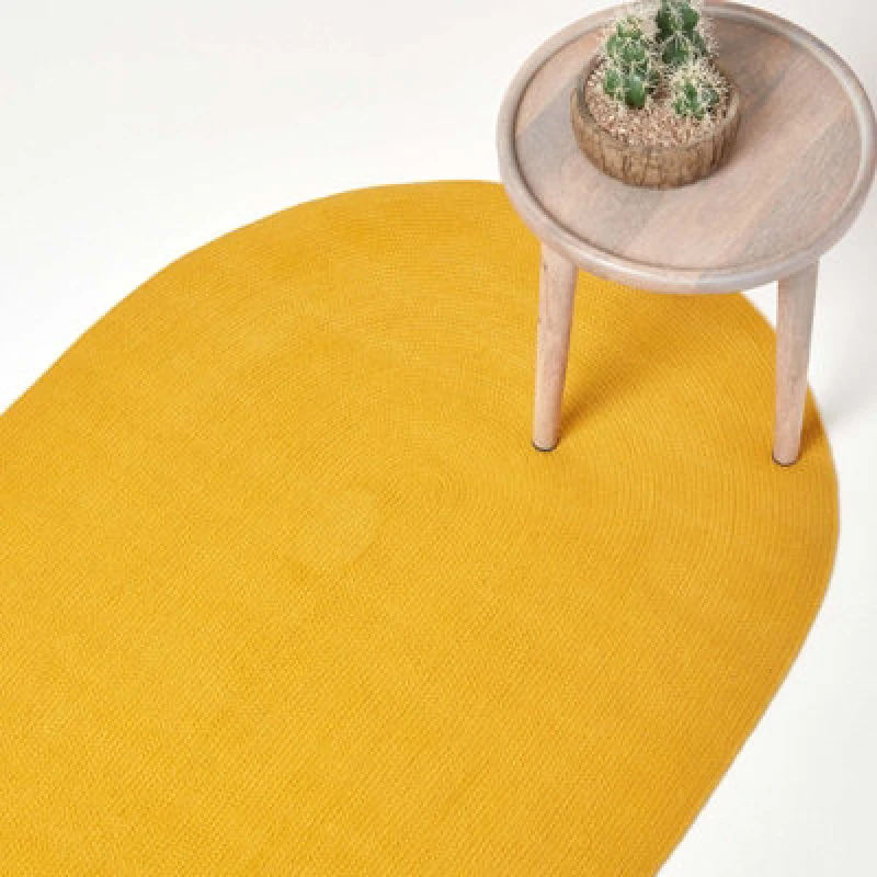 Image of Homescapes Mustard Yellow Handmade Woven Braided Oval Rug, 90 X 150 Cm